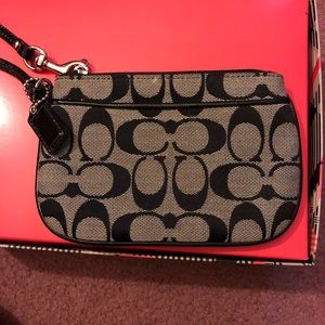 Black and grey COACH wristlet